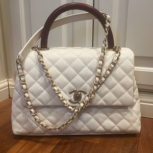 Woman’s handbag. Handle is burgundy/brown